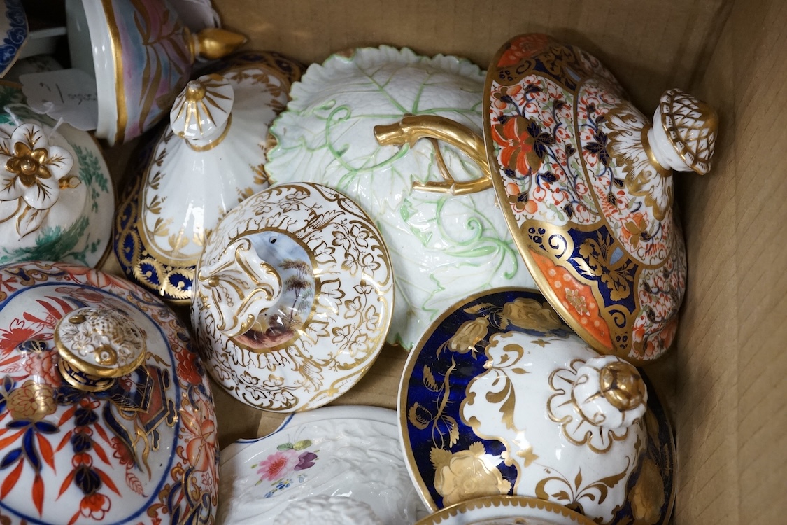 A collection of porcelain tureen and pot covers, largely 19th century